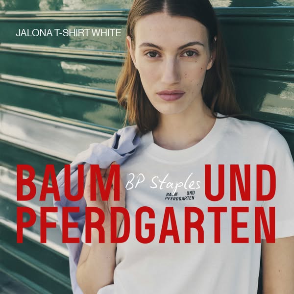 This ad promotes the Jalona T-shirt in white from Baum Und Pferdgarten. The ad features a woman wearing the t-shirt with