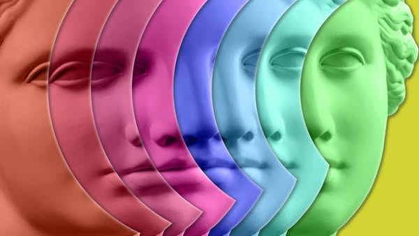 The ad features a row of six vertically sliced classical sculpture faces in different solid colors. The ad lacks typical