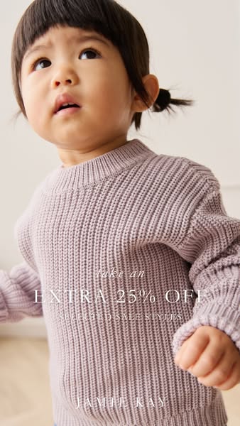 This ad features a young child modeling a knit sweater and informs the viewer of a sale from Jamie Kay.