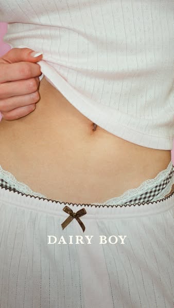 This ad features a close-up shot of a person wearing clothing from Dairy Boy, focusing on the midriff area to highlight 