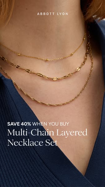 An ad for an Abbott Lyon multi-chain layered necklace set. It features a close up of three different necklaces and inclu