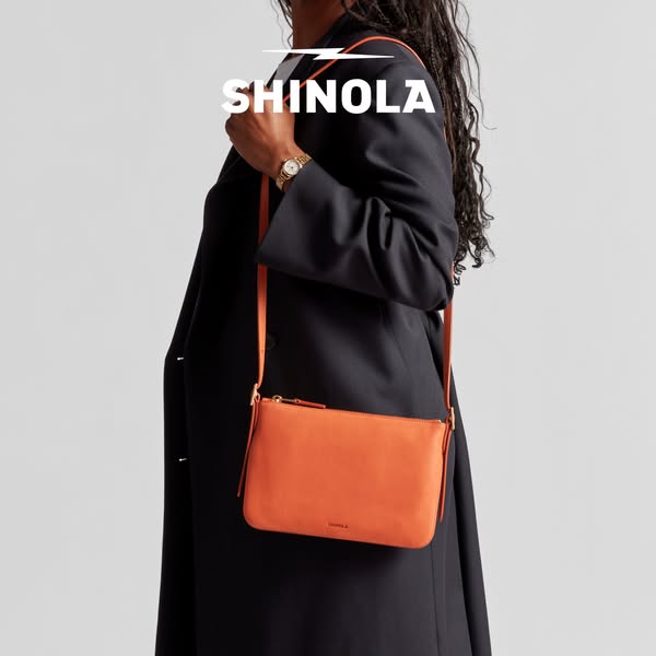 This ad features a woman modeling a Shinola leather crossbody bag. The ad focuses on the bag's stylish appearance an