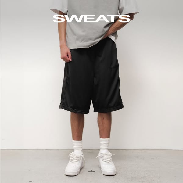This ad promotes the brand "SWEATS" and features a person wearing a pair of black shorts. The focal point is o