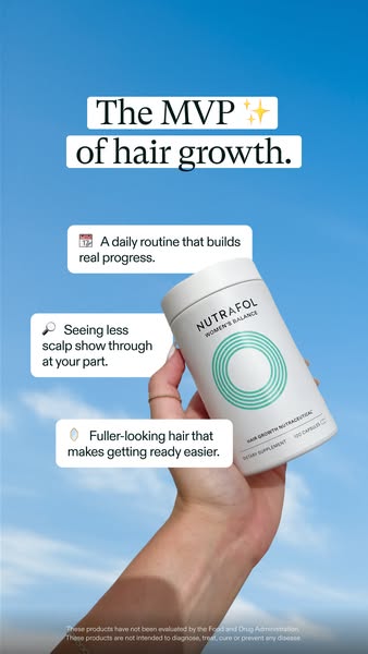 The image ad features a hand holding a bottle of Nutrafol Women's Balance supplements. The ad highlights the benefit