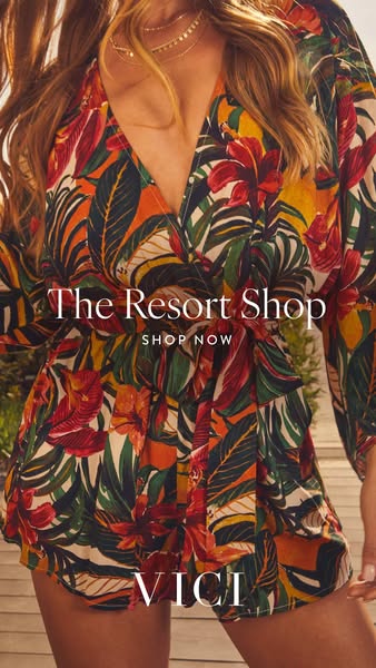 This ad features a woman wearing a floral print wrap romper from Vici, encouraging viewers to shop the resort shop.
