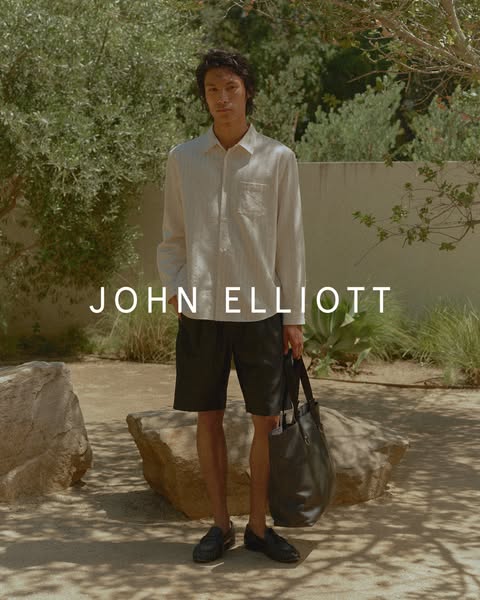 A man is wearing apparel from John Elliott.