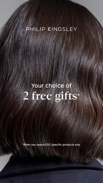 This ad by Philip Kingsley promotes an offer of two free gifts with a purchase of £70 or more, and features an image of 