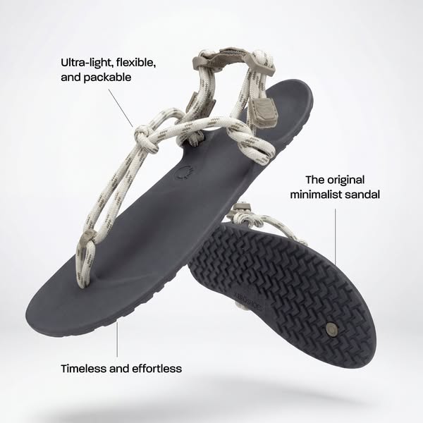 This ad features a single image of minimalist sandals.  The sandals are elevated against a gradient grey background. Tex