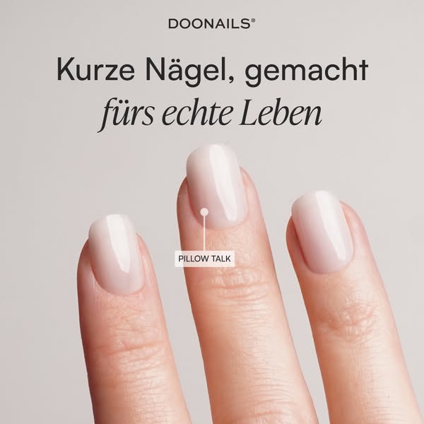 This image ad for Doonails shows a close-up of a hand with short nails that have been painted with the brand's '