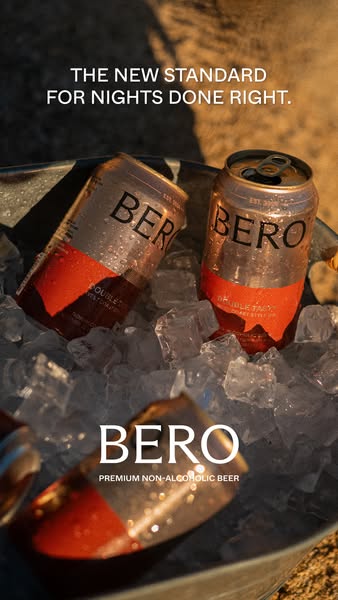This ad features BERO premium non-alcoholic beer. The ad showcases a bucket of ice with cans of BERO beer inside. The ad