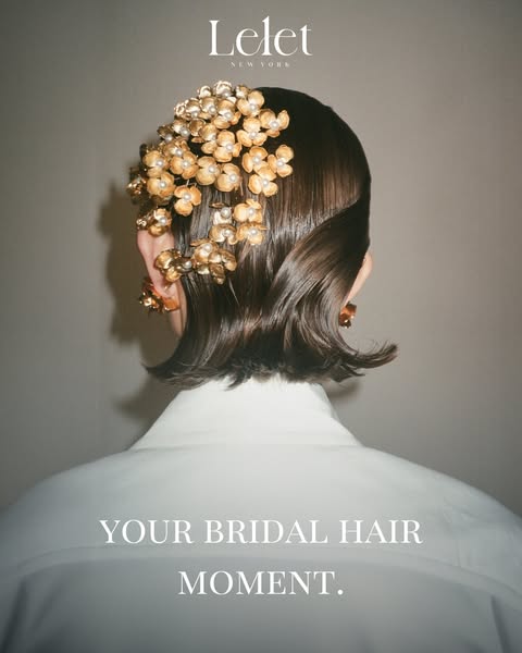 This ad showcases a hair accessory by Lelet NY. The focus of the ad is on a gold, flower-shaped hair accessory in the co