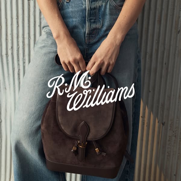 This ad features a single image of the R.M. Williams backpack being held in front of a wall. The brand logo is prominent