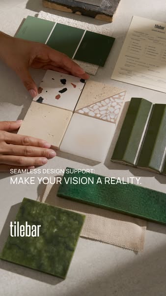 This image ad for Tilebar showcases a hand arranging different types of tiles to show their diverse range of products. T