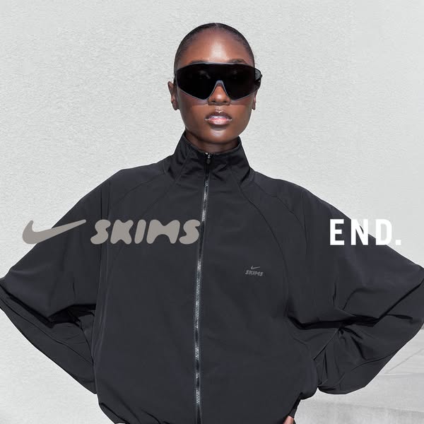 The ad features an image of a Black model wearing a SKIMS x Nike jacket. The image advertises the collaboration between 