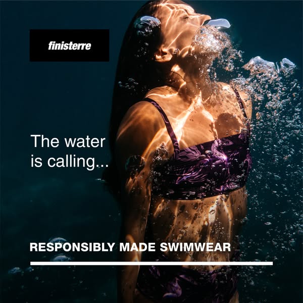 This Finisterre ad features an underwater shot of a woman wearing a purple patterned Finisterre swimsuit. The ad copy hi