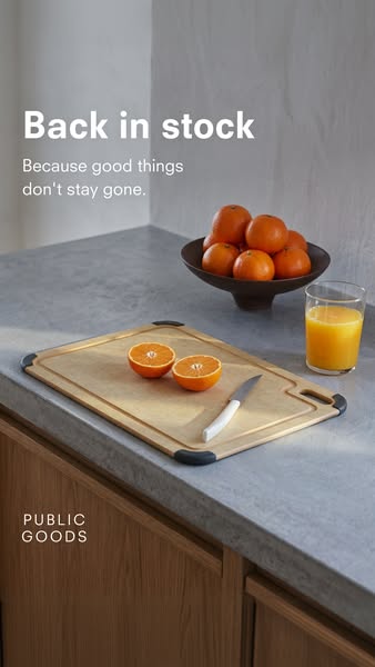 An image of a countertop scene with fresh oranges, orange juice, a cutting board with cut oranges, and a knife to promot