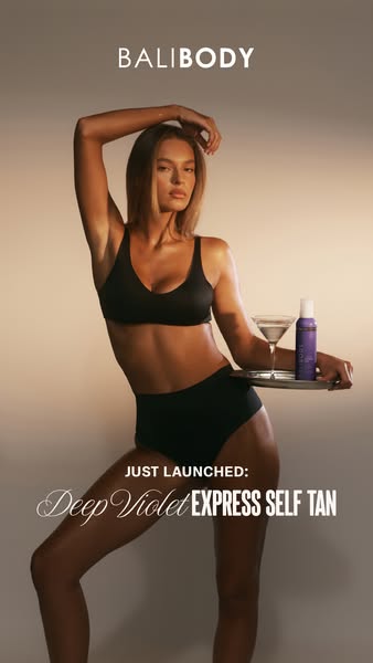 The ad showcases Bali Body's Deep Violet Express Self Tan with a model in a bikini and a martini glass.