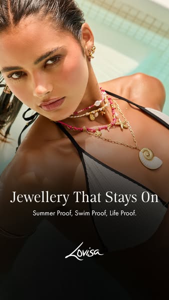 An ad for Lovisa jewellery showing a woman in a pool or water wearing their products that are waterproof for the summer.