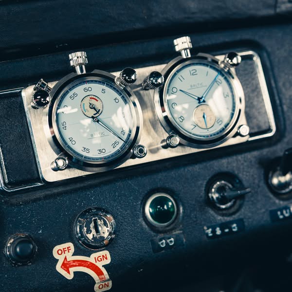 The ad showcases two Baltic watches mounted on a dashboard. The watches are highlighted against the dashboard, creating 