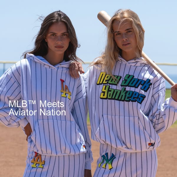 This ad promotes a line of apparel that merges MLB team logos with the Aviator Nation brand aesthetic. It features two m
