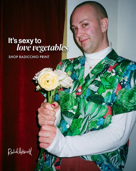 An image ad featuring a person in a botanical shirt holding a bouquet of flowers. The ad promotes the brand Rachel Anton