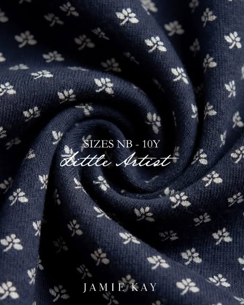 This image ad for Jamie Kay shows a close-up shot of a navy blue knit fabric with a white floral pattern. The ad copy st
