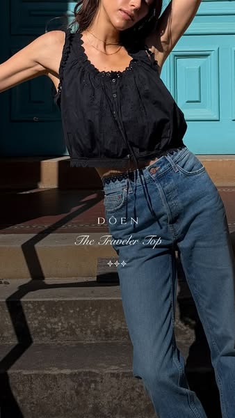The image ad showcases a woman wearing a black 'Traveler Top' from the brand Doen. The ad focuses on the product