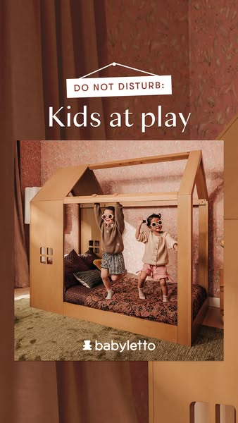 This image ad for babyletto features two young children playing in a house-shaped bed.