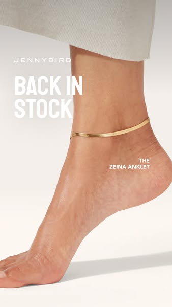 This ad features an ankle and lower leg of a person wearing a gold herringbone anklet. The ad indicates the product is b