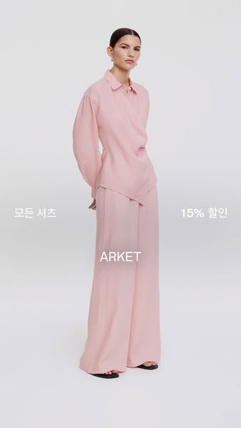 This ad features a woman modeling a pink linen shirt and pants set from the brand ARKET. The ad promotes a 15% discount 