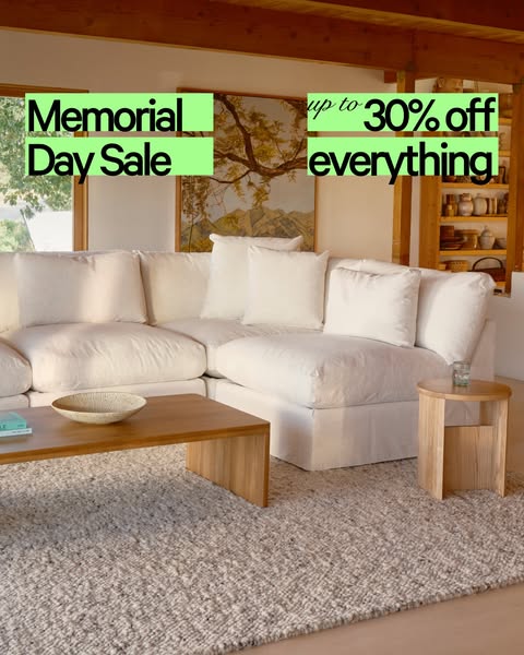 This is an image ad for a furniture company's Memorial Day sale. The ad features a bright, neutral-toned living room