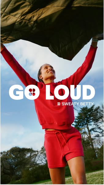 This ad for Sweaty Betty apparel features a woman holding a jacket above her head, looking up at it. The ad's headli