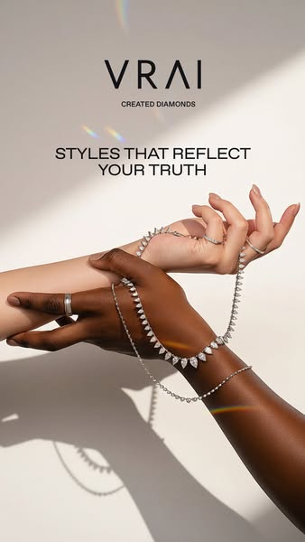 A sleek advertisement for VRAI's lab-grown diamonds, showcasing a necklace, ring, and bracelet against a neutral bac