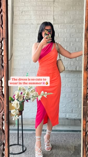 An image ad featuring a person wearing a two-tone orange and pink dress that she considers very cute to wear in the summ