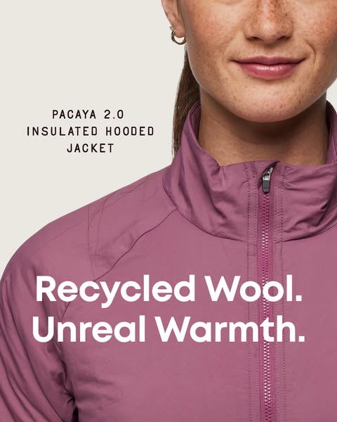 A close up shot of a woman in an insulated hooded jacket made with recycled wool. The main selling point in the ad is th