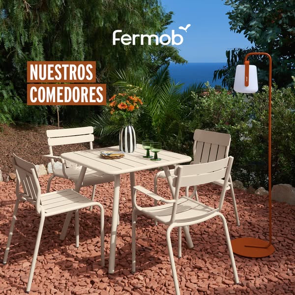 This ad showcases the Fermob outdoor dining set within an outdoor setting, suggesting a lifestyle of leisure and enjoyin