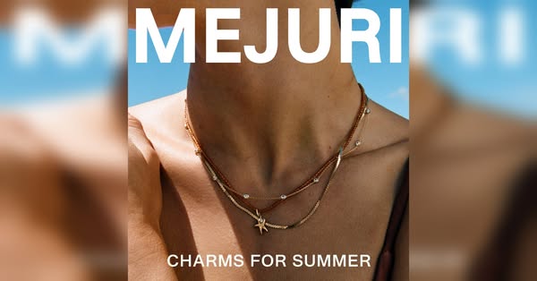 This image ad showcases a woman's neck adorned with three delicate, layered gold necklaces from Mejuri. The necklace