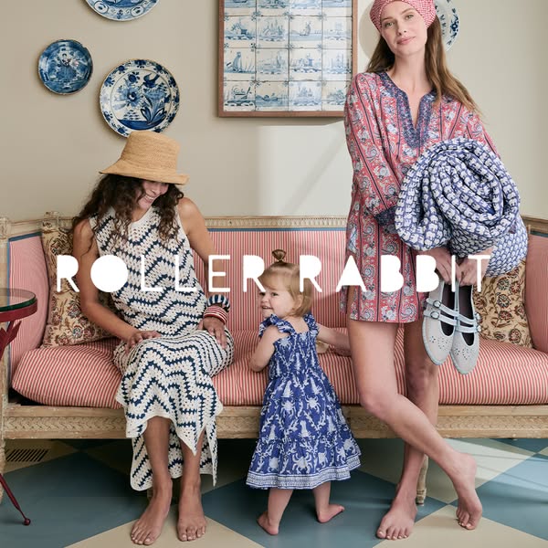 The ad features a photo of three models in Roller Rabbit clothing. A woman sits on a bench next to a young girl and anot