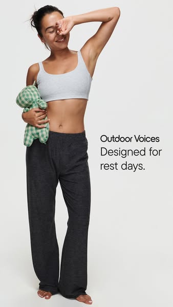 This ad showcases Outdoor Voices activewear designed for rest days, featuring a woman in a sports bra and sweatpants hol