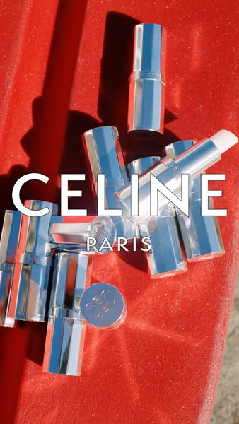 This ad for Celine lip balm features a pile of lip balms against a textured red surface. The ad spotlights the product a