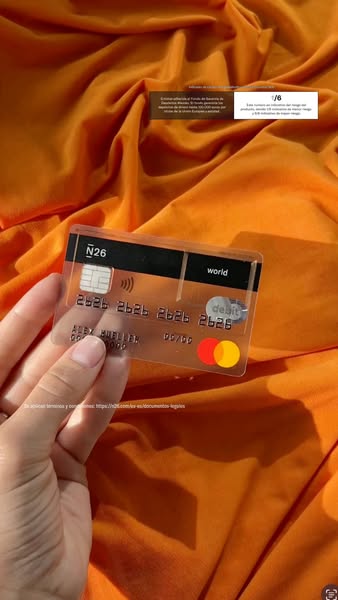 The ad showcases a transparent debit card from N26, emphasizing its modern design and highlighting bank-backed security.